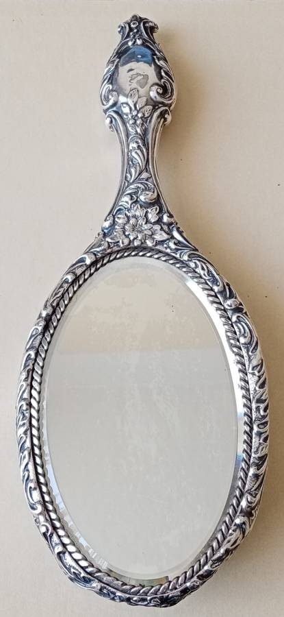 1902 Victorian hallmarked silver handheld mirror with floral design