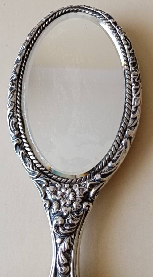 1902 Victorian hallmarked silver handheld mirror with floral design