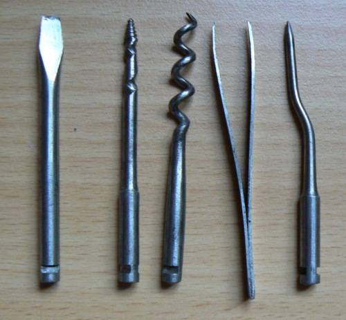 Vintage compact multitool with four bits plus tweezer