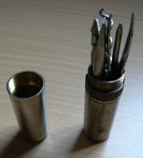 Vintage compact multitool with four bits plus tweezer