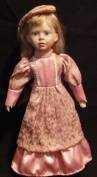 Porcelain doll with stand. (+- 44cm Tall)