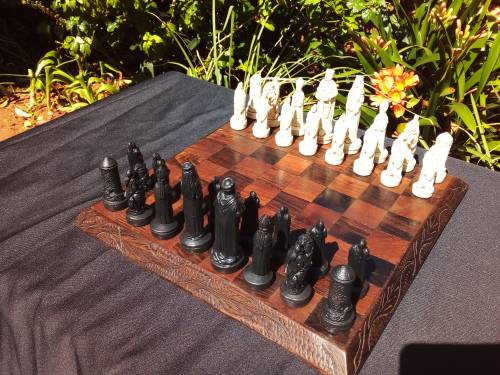 MEDIEVAL FIGURINE`S ON AN AMAZING HAND CRAFTED MARANTI WOOD CHESS BOARD