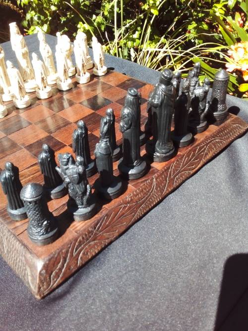 MEDIEVAL FIGURINE`S ON AN AMAZING HAND CRAFTED MARANTI WOOD CHESS BOARD