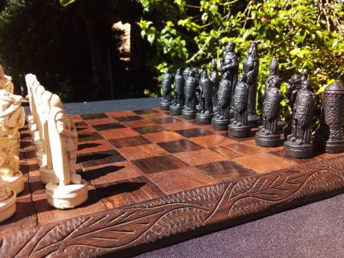 MEDIEVAL FIGURINE`S ON AN AMAZING HAND CRAFTED MARANTI WOOD CHESS BOARD