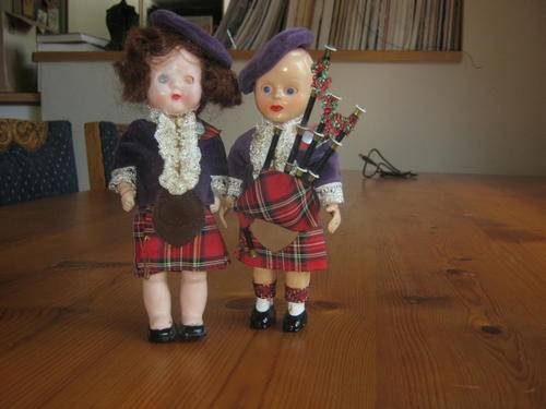 Two small pastic dolls in Scots garb...