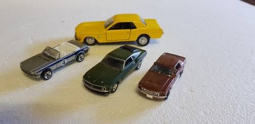 Lovely lot of 4 ford mustang die cast cars