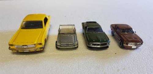 Lovely lot of 4 ford mustang die cast cars