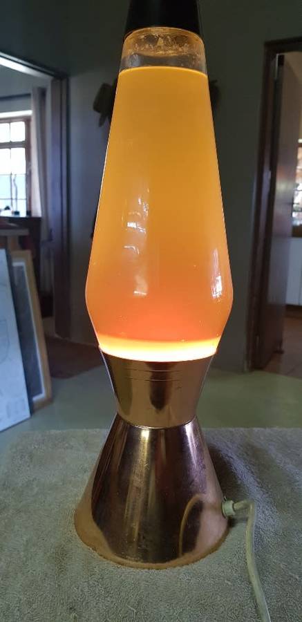 Vintage lave lamp with brass base.. Globe works