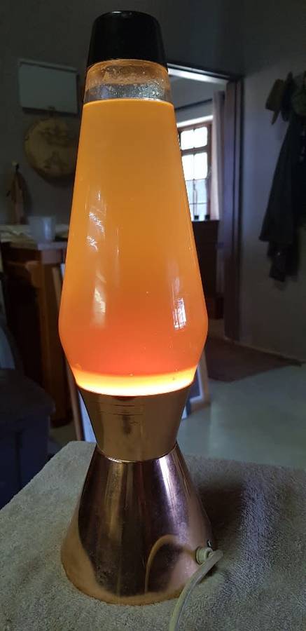 Vintage lave lamp with brass base.. Globe works