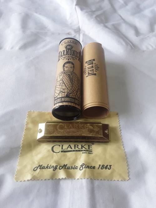 VINTAGE BRASS HARMONICA WITH INFORMATION SHEET IN ORIGINAL CASE
