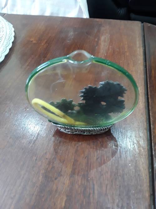 VINTAGE ITEM(MORE OF AN OIL JAR) METAL FLOWERS