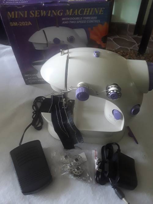 DOUBLE SPEED CONTROL MINI SEWING MACHINE (FREE ASSESCORIES)