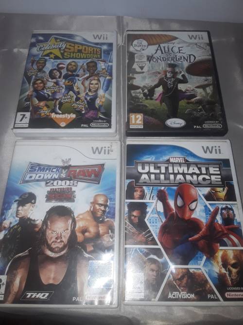 NINTENDO WII CONSOLE INCLUDING P.SUPPLY ,4 GAME DISCS AND ASSESCORIES