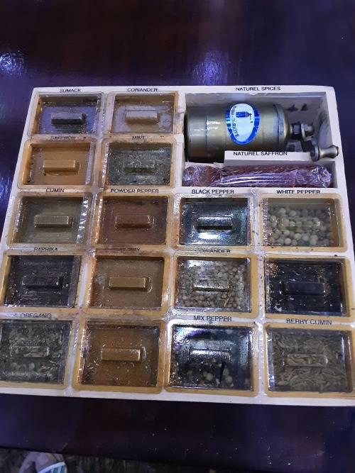 NATURAL SPICE BOX(17  LABELED SPICES IN WINDOW DRAWER INCLUDING A BRASS SPICE GRINDER)