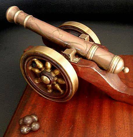 MODEL CANON COPPER AND BRASS,ENGRAVINGS ON GUN BARREL ,WOODEN AND BRASS WHEELS  ETC.