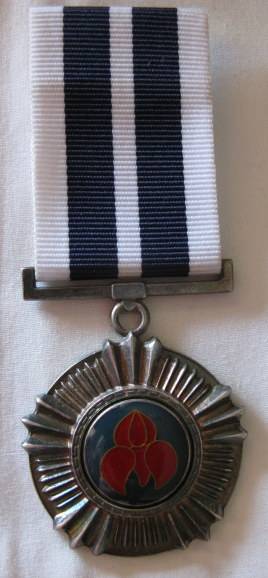 PRO MERITO MEDAL (1975) FULL SIZE NUMBERED 1810 WITH 1986 ISSUE RIBBON