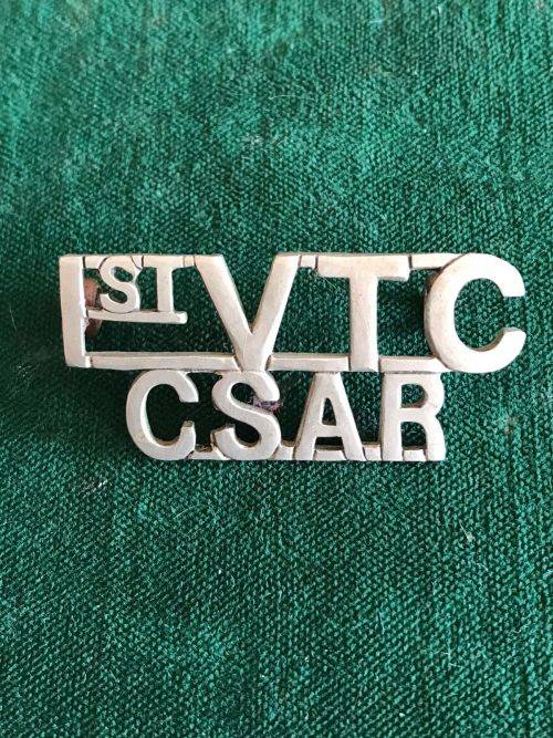 1ST VOLUNTEER CORPS-CENTRAL SOUTH AFRICAN RAILWAYS,WHITE METAL TITLE -WORN 1902-1906- 2 LUGS