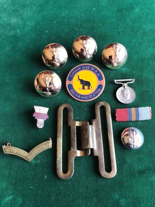 SELECTION OF 13 RHODESIAN BADGES ,MEDALS AND OTHER ITEMS-SOLD TOGETHER