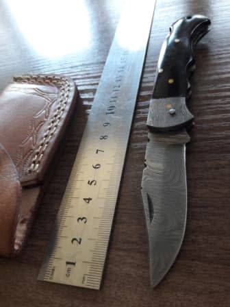 Handmade Damascus steel folding knife with BULL Horn handle scales