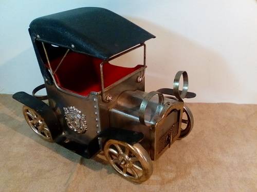All Metal Vintage Oldsmobile Musical Car that was used to hold Decanter & Glasses