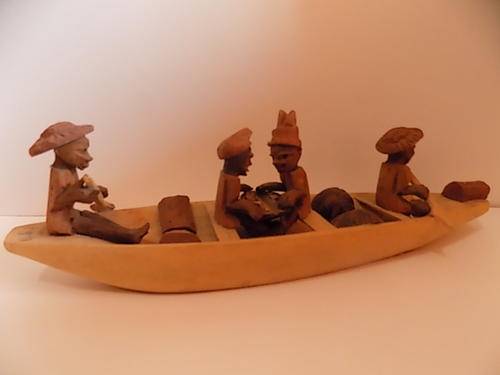 Carved Wooden Boat with Figurines Inside