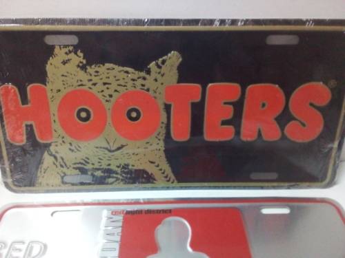 Two Light Metal Signs
