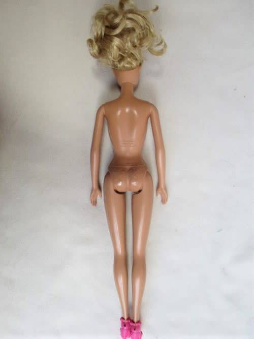 PRETTY CURLY-TOPPED MATTEL BARBIE DOLL