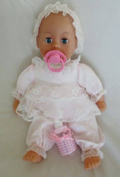 A VERY COLLECTABLE CRYING, GURGLING, COOING BATTAT BABY DOLL WITH OPEN/CLOSE EYES