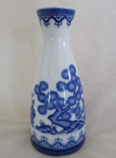 CHARMING BLUE AND WHITE PORCELAIN SAKE DECANTER DEPICTING CHILDREN PLAYING - SIGNED ON BASE