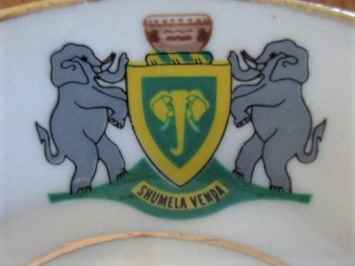 VINTAGE AND HISTORICAL - FORMER HOMELAND VENDA CUP AND SAUCER DEPICTING VENDA COAT OF ARMS
