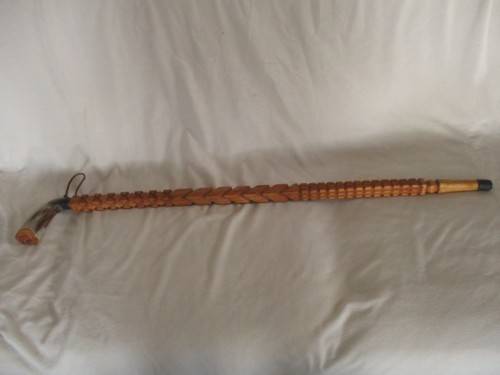 A VINTAGE ORNATELY CARVED, BONE HANDLED WOODEN WALKING STICK