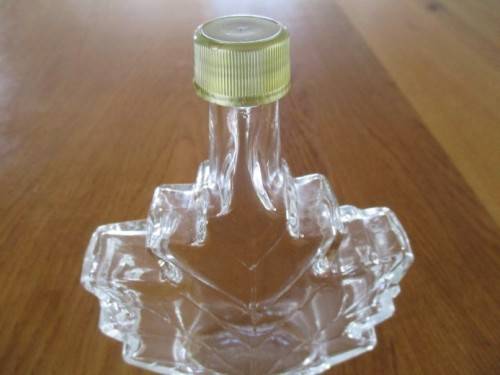 PRETTY AND UNUSUAL -  CANADIAN MAPLE LEAF SHAPED BOTTLE