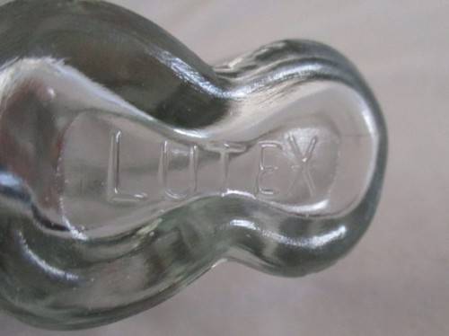 TWO UNUSUAL MALE AND FEMALE TORSO LUTEX GLASS BOTTLES