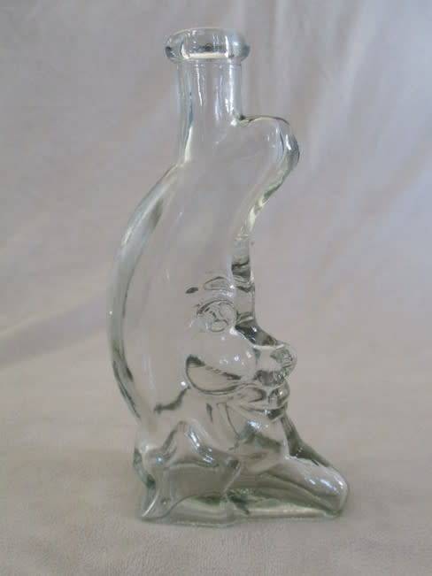 A CUTE CRESCENT MAN-IN-THE-MOON BOTTLE