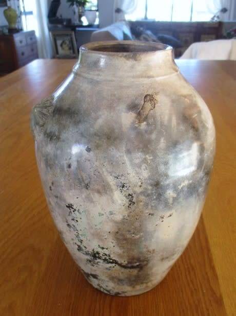 THERE IS SOMETHING SO NOT AVERAGE ABOUT THIS LARGE, HEAVY, BEAUTIFULLY GLAZED VASE
