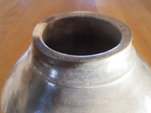THERE IS SOMETHING SO NOT AVERAGE ABOUT THIS LARGE, HEAVY, BEAUTIFULLY GLAZED VASE