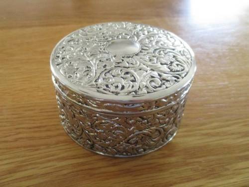 VERY DECORATIVE SILVER METAL TRINKET BOX WITH RED VELVET LINING (PLEASE DISREGARD REFLECTIONS)
