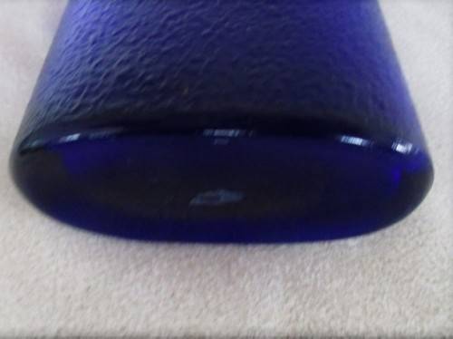 A TALL, UNUSUAL VINTAGE BLUE BOTTLE DEPICTING GRECIAN LADY