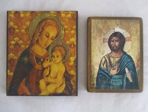 TWO RELIGIOUS ICONS MOUNTED ON WOOD