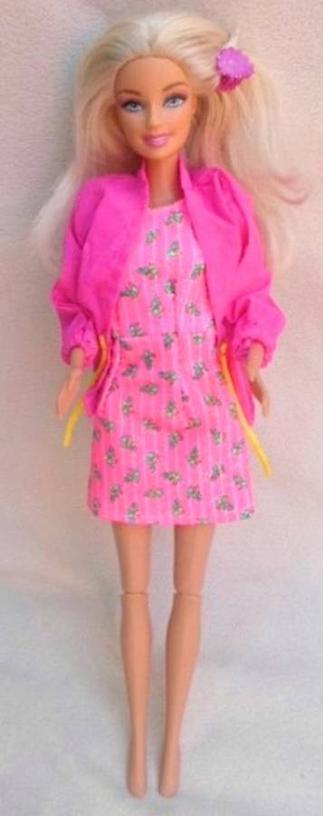 RATHER DIFFERENT 2011 MATTEL BARBIE WITH PUSH BUTTON ON BACK!!