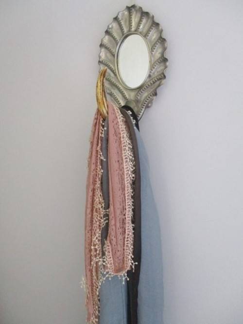ANTIQUE AND UNIQUE - SILVER METAL FRAMED MIRROR WITH WARTHOG TOOTH HOOK/HANDLE