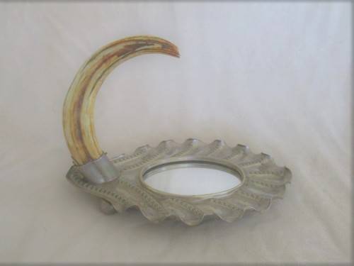 ANTIQUE AND UNIQUE - SILVER METAL FRAMED MIRROR WITH WARTHOG TOOTH HOOK/HANDLE
