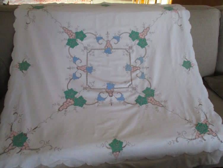 A large vintage embroidered Madeira table cloth with lovely detail