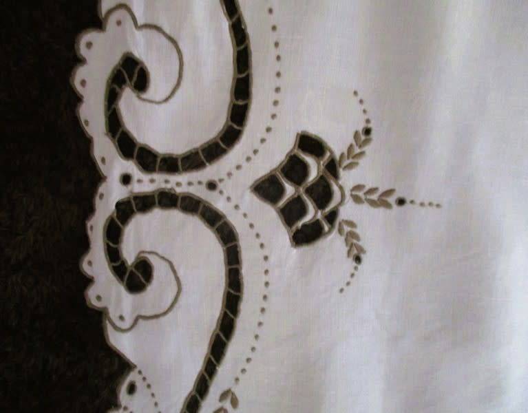 A medium-sized vintage cutwork embroidery cloth from Madeira with floral and butterfly wings detail