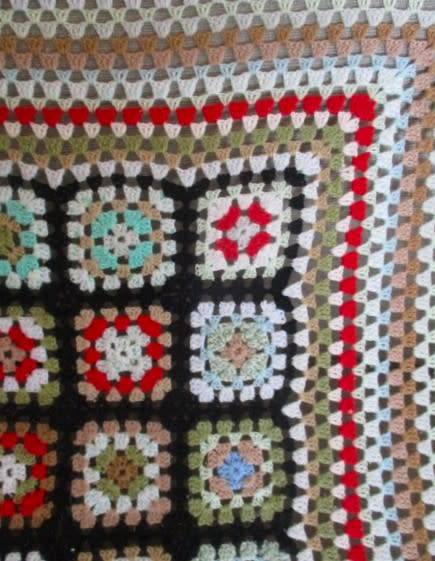 A hand crocheted wool blanket with soft colours - 190cm x 176cm
