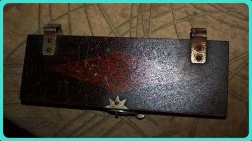 OLD WOODEN  PRESS WITH UNUSUAL CLASP