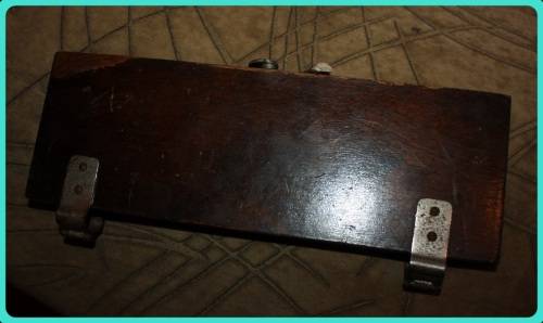 OLD WOODEN  PRESS WITH UNUSUAL CLASP