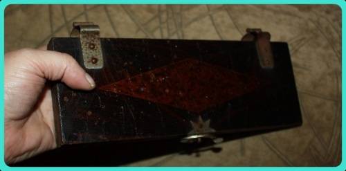 OLD WOODEN  PRESS WITH UNUSUAL CLASP