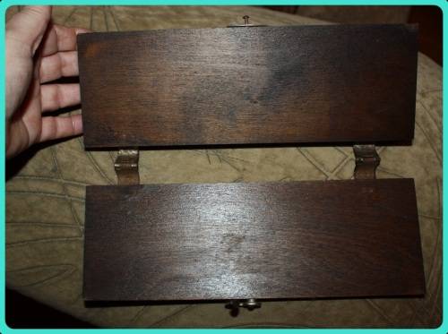 OLD WOODEN  PRESS WITH UNUSUAL CLASP