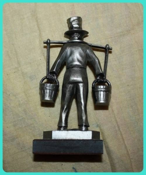 METAL STATUETTE MAN CARRYING BUCKETS HAMBURG ON BASE